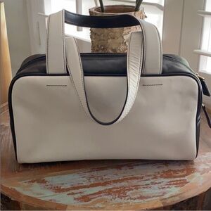 Black and White Adrienne Vittadini mini shoulder bag with black leather handles
